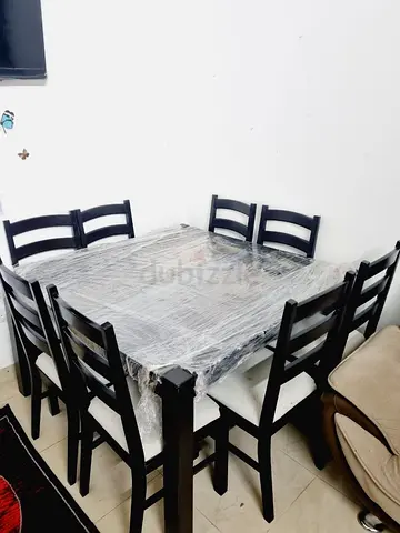 Solid wood 8-seater dining table with chairs - dark finish