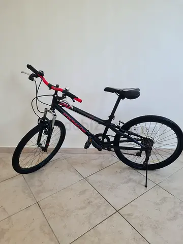 Promade mountain bike in black and red 24 inches 3 year old