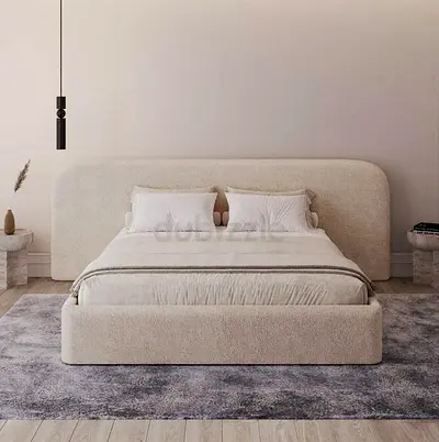 Modern upholstered bed frame in cream boucle fabric