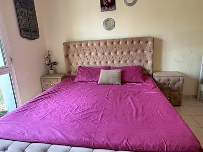 King size bed with upholstered headboard and matching bedside cabinets - light beige