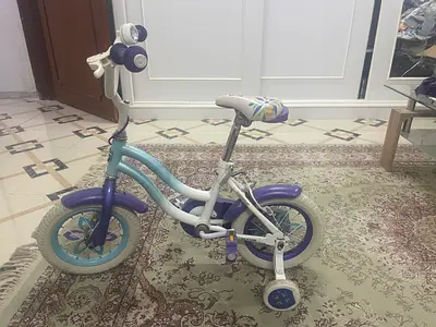 Small childrens bike with training wheels - good condition