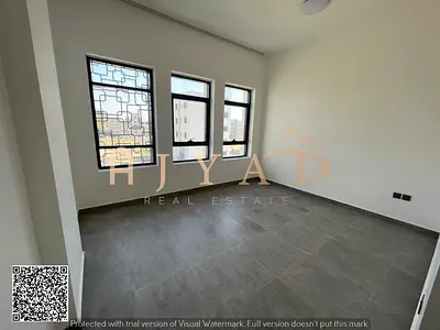 For annual rent: Two-bedroom apartment in Al-Aliya, Ajman, near Sheikh Mohammed Bin Zayed Road. Two bedrooms (one master), two bathrooms, balcony