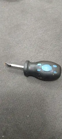 Used Phillips screwdriver with rubber grip — single small hand tool
