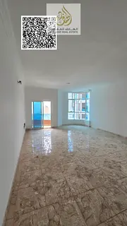 Three-bedroom apartment with a living room and a maid's room in Al Nuaimiya Towers