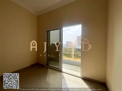 Annual rent first occupancy 2BR apartment in Al Jurf 3 Ajman near Dubai and Sharjah exit 3 baths balcony wardrobes central AC modern finish