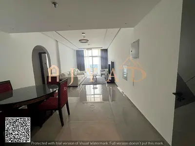 Annual rent 2BR hall, first tenant in new tower Al Nuaimiya 3 near Dubai Islamic Bank, opposite Sharjah Coop. Central AC, free parking.
