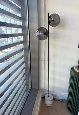 Modern double-globe floor lamp with marble base.