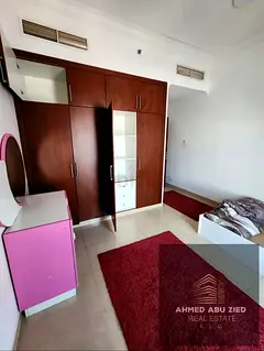 The largest two rooms and a hall in Concord Towers, Khalifa Street, Ajman, near City Center, furnish