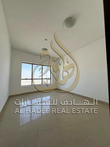 2BR apartment on Al Wahda Road with free parking, direct Dubai access, near services and transport, 4 or 6 cheques.