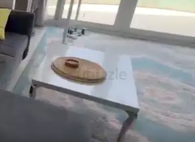 White modern coffee table with metal legs