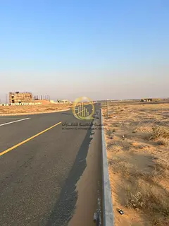 For sale: land in Rawdat Al-Qurt, area 8,286 sq ft, corner on two streets 24 meters, freehold owners