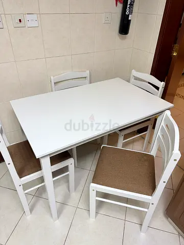 Simple white dining table with 4 chairs - good condition
