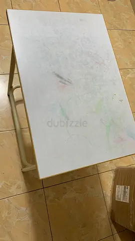 Small white study/side table with metal frame — used