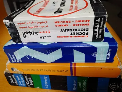 Set of 4 Pocket and School Dictionaries (English-Arabic, English-Malayalam, Oxford learners)