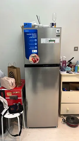 Silver top-freezer refrigerator - good condition