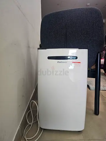 Portable dehumidifier - compact white unit, good condition