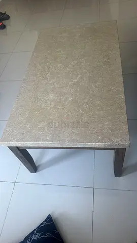 Faux marbled-top coffee table with wooden legs