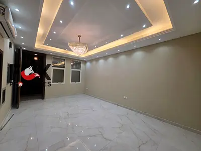 Villa for sale or rent in Al Yasmin, 5 master bedrooms, 2 living rooms, yard, and electricity. Sale