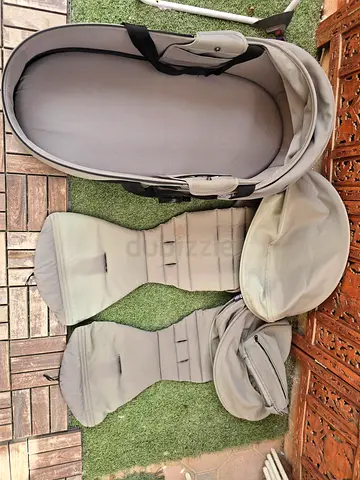 Light grey detachable bassinet with multiple liners and canopies - used