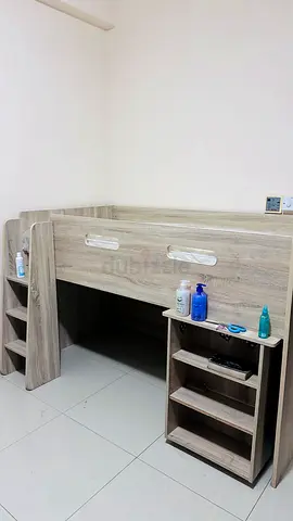 Loft-style single bed with built-in shelves - light wood finish