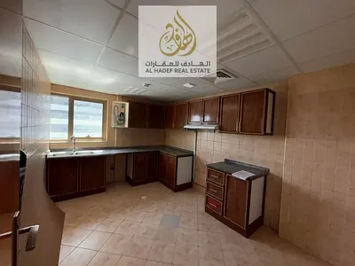 Annual rent in Ajman, Al Rashidiya 3, next to Grand Mall. Two bedrooms, living room, balcony, 3 bat