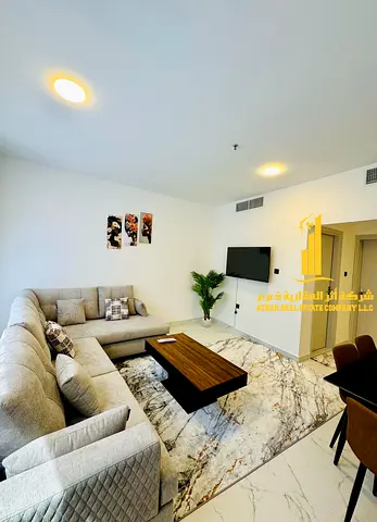 Beautiful one-bedroom apartment with a balcony, fully furnished with new furniture, available for monthly rent in Ajman - Corniche.