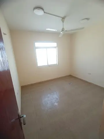 Two-bedroom apartment with living room for rent in Al Nuaimiya 1 next to Hamdan Center – central AC