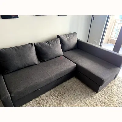 Dark grey L-shaped sofa with storage — good condition