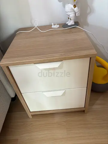 Compact two-drawer bedside cabinet in light oak and white