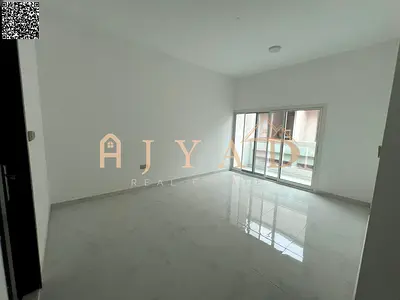Brand new first-tenant 2BR hall apartment for annual rent in Mowaihat 3. 2 master rooms, 3 baths, balcony, central AC, near services, easy Dubai exit.