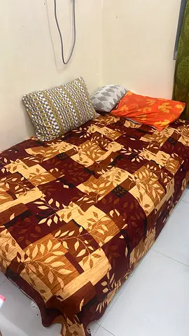 Single-seater sofa/chaise with patterned throw cover - good condition the price is negotiable