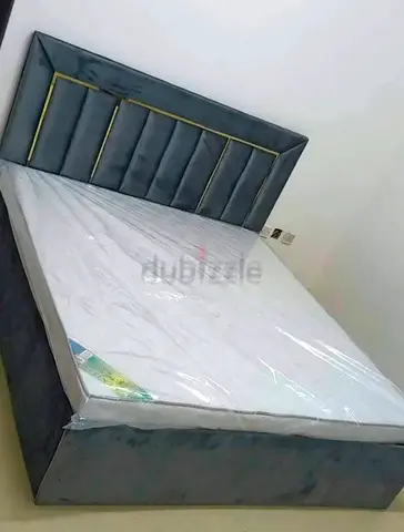 Brand New Grey upholstered Queen size bed with headboard and mattress
