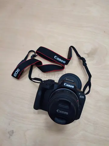 Canon EOS R50 with kit lens and strap - good condition