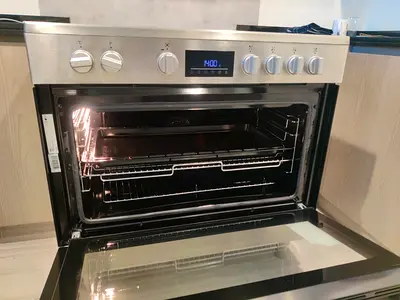 Beko 90x60cm freestanding ceramic electric cooker stove with a stainless steel finish