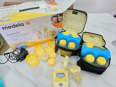 Medela Freestyle Double Electric breast Pump free manual pump, sterilizer and food maker