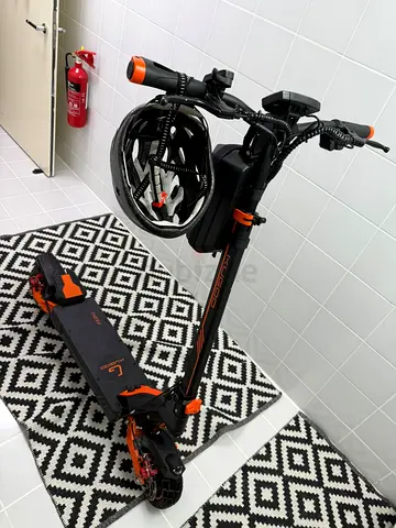 Electric Scooter with Helmet — Good Condition, Ready to Ride