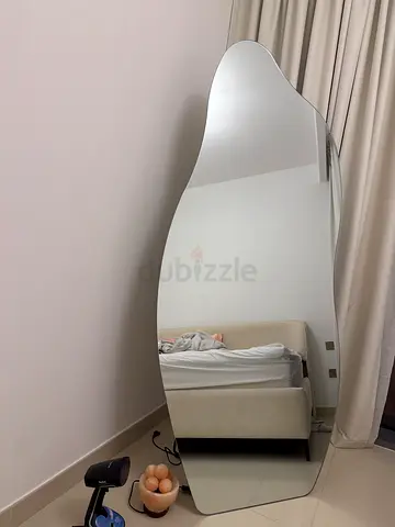 Full-length freeform wall mirror — modern wavy design