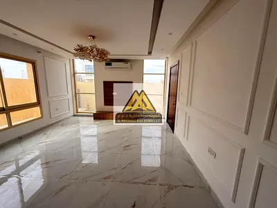 Beautiful villa with 5 master bedrooms, a majlis, a living room with a large balcony, a maid's room