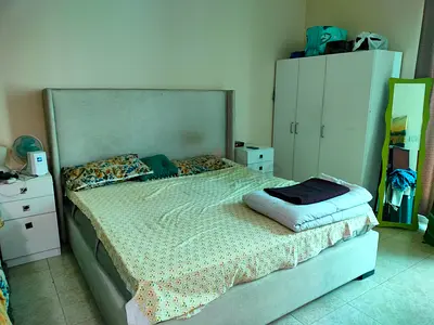 King size upholstered bed with mattress and bedside tables