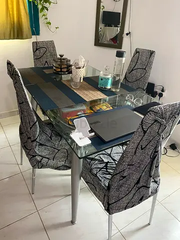 Glass Top Dining Table with 4 Fabric-Covered Chairs - Good Condition