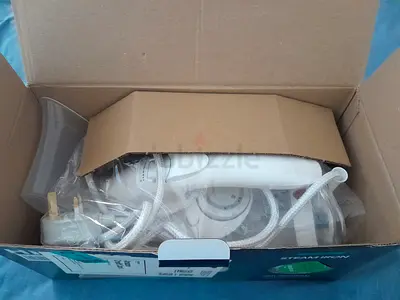 Lightweight Steam Iron in Original Box - used only once.