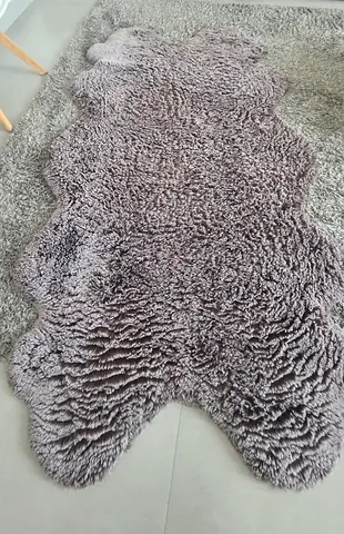 Soft grey sheepskin-style rug (single piece) - good condition
