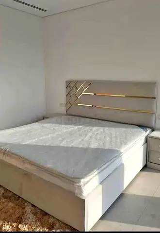 Modern Bed with Upholstered Gold Accent Headboard