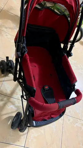 Used red baby stroller/pram - good working condition