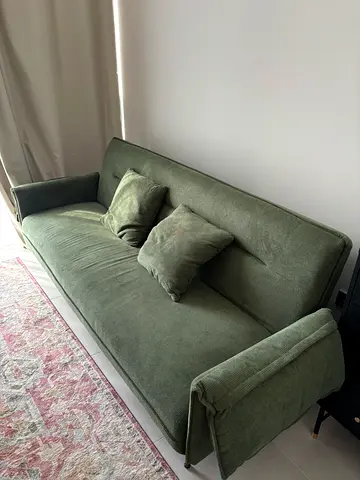 Green fabric 2-seater sofa in excellent condition