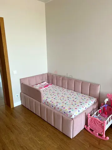 Pink upholstered toddler/childrens day bed with storage