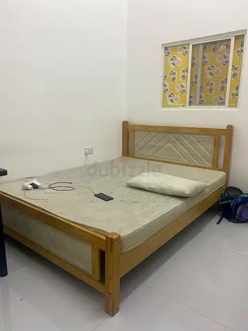 Solid wood double bed with headboard and mattress
