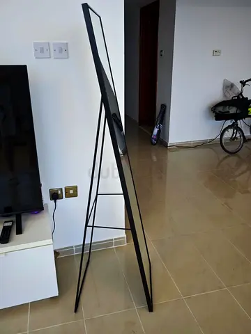 Full-length freestanding mirror with slim black metal frame