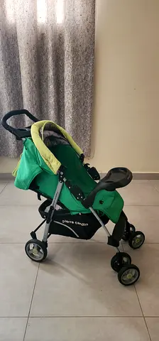 Lightweight green Pierre Cardin baby stroller - good condition