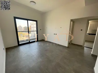 2BR apartment for annual rent in Al Alia, Ajman. Free month, balcony, sunny view, hotel-style finish, central AC, easy Dubai & Sharjah access.